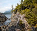 People sitting on the rocks at Hot Springs Cove in Maquinna Marine Provincial Park