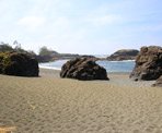 Huge rocks along South Beach near Tofino, BC, as the waves pound the shoreline